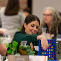 person playing Connect 4 game